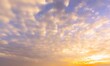 © PrimeBackgrounds - Beautiful view of a blue sky with clouds at sunrise, featuring a cinematic blend of yellow and white hues. Perfect for social media post designs and natural sky backgrounds.