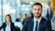 © Napak - Confident businessman portrait, modern office setting