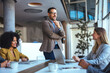 © Dragana Gordic - Professional Team Collaborating in Modern Office Environment