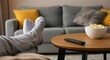 © Artyom - Relaxing at home with popcorn and TV remote on cozy sofa