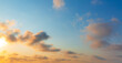 © banjongseal324 - Orange clouds and morning sky,Real majestic sunrise sundown sky background with gentle colorful clouds without birds. Panoramic, big size,Sunset sky clouds in the evening summer with Orange,