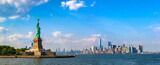 Statue of Liberty against Manhattan on a sunny day