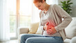 © Radorog. - A woman holds her stomach pretending to be in pain