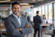 © PRASANNAPIX - middle age businessman standing confidently at office
