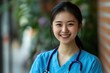 © liu - Portrait of smiling chinese nurse looking at camera