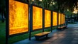 © Rendra - Illuminated park pathway with backlit photo panels.
