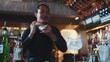 © InfiniteFlow - Asian smart bartender shaking mixed cocktail preparing to serve at luxurious counter preparation, making special drink looking at camera fronted view. Special refresh drink nightlife luxury. Vinosity.