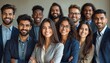 © Vadym - Group of smiling Indian MBA students posing together. Diverse team in business suits. Happy people celebrating success. Education, career, achievement, professional growth, community. Young ambitious