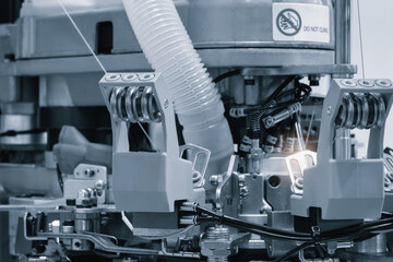 Poster - Industrial machine for embroidery of multi-colored threads on fabric