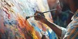 © Mohsin - Close up of african american male painter at work painting on canvas in art studio