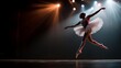 © icik icik bum - Ballerina Leaps on Stage in Dramatic Lighting