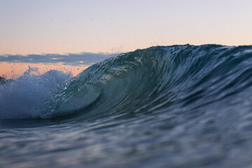 Canvas Print - Wave barrel at the beach in the morning.