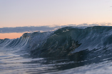 Canvas Print - Clean wave breaking at the beach.
