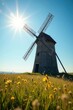 © ORAWAN - Rustic windmill, sun-drenched field, blue sky, grass, summer, tower