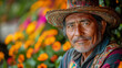 © Rajesh - A thoughtful Mexican man in a colorful hat is surrounded by vibrant flowers