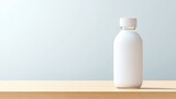 Blank, white bottle on light wooden surface