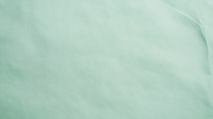 Wall Mural - light green crumpled paper texture forming an abstract background