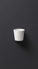 Poster - White ceramic cup hanging on dark gray wall, minimalist design