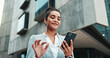© CC/peopleimages.com - Business woman, phone and walking in city for travel with communication, internet or connection. Happy corporate worker online for social media networking, mobile app or text contact for deal outdoor