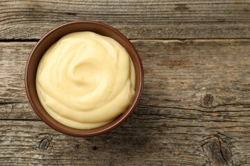 Wall Mural - tasty vanilla pudding on wooden table, top view. space for text