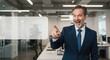 © Qstock - Confident Businessman Pointing in Modern Office with Blank Space for Text and Professional Presentation or Marketing Ideas.