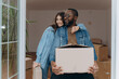 © Volodymyr - Happy Couple Moving Into New Home with Cardboard Boxes