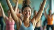 © elimicel - Triumphant Fitness Enthusiast, Celebrating Wellness and Success in a Group Fitness Class