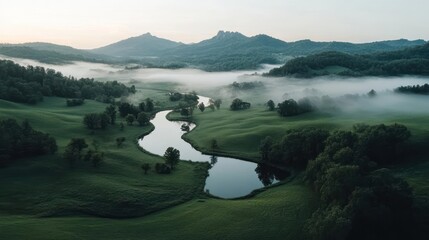 Aufkleber - Aerial view of a misty landscape featuring a winding river and reflective ponds amidst green fields with gentle hills in background