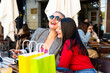 © Alfonso Soler - Two happy women enjoying shopping and urban lifestyle