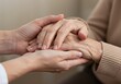 © GS-Studio - Gentle Hands: A tender moment captured in an intimate embrace, showing a younger hand gently holding the hand of an elderly person. The image encapsulates care, compassion.