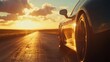© Daria - Close up side view of a car driving toward the horizon on an empty road under a stunning sky
