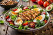 © Design Mart - A gym-lover salad with grilled chicken, boiled eggs, and seeds for a balanced meal .