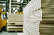 © Adobe - Stacked particleboard sheets in a warehouse