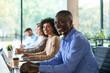 © ty - African american man working at call center office to help people with telemarketing assistance. Male employee using headphones and microphone at customer care service