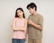 © Chanakon - Bad relationship unhappy asian couple quarreling in various action gesture standing on isolated white background. Shouting angry man and woman stressed has problem in Married life