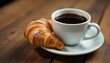 © Monster - A close-up shot features a white ceramic cup filled with dark coffee, positioned next to a golden-brown croissant dusted with powdered sugar