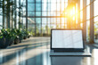 © Vovmar - Laptop with blank white screen on office desk with blurred interior of modern office with many green plants. Blank screen for product demonstration. Generated by artificial intelligence