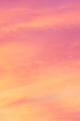 Wall Mural - Sky with soft and fluffy pastel coral orange pink and blue colored clouds. Sunset background. Nature. sunrise. Instagram toned style