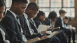 © VIDYASKANDAN - A row of students wearing uniforms, reading textbooks with deep concentration, classic school setting