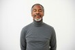 © Skyfe - Serene Older African Man Turtleneck Sweater Closed Eyes White Background - Mindfulness, Meditation, Wellness Concept Stress Relief Self-Care Campaigns