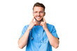 © luismolinero - Young nurse man over isolated chroma key background smiling with a happy and pleasant expression