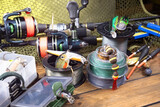 Fishing tackle on the table in a composition.