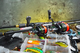 Fishing tackle on the table in a composition.