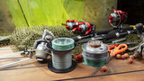 Fishing tackle on the table in a composition.