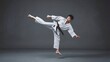 © Ева Поликарпова - A martial arts practitioner in traditional Japanese clothing performs a kicking technique