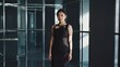 © Ева Поликарпова - A woman stands alone in a room wearing a black dress, suitable for various scenarios such as drama or mystery settings