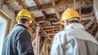 © Guy - Inspection of Damaged Ceiling: Two professionals, donned in protective hard hats, meticulously assess the structural integrity of a damaged ceiling.