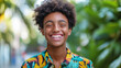 © Erwin - An expressive depiction of a young black boy smiling in a tropical shirt.