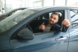 © Serhii - Man customer male buyer client chooses auto wants to buy new automobile
