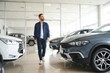 © Serhii - Man customer male buyer client chooses auto wants to buy new automobile